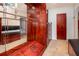 This custom closet features rich wood tones, ample storage and unique etched dragon design at 9130 Dresden Ln, Port Richey, FL 34668