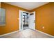 Bright foyer featuring tile floors, glass block window, and unique paint colors at 9130 Dresden Ln, Port Richey, FL 34668