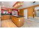 Kitchen with wooden cabinets, granite countertops, and a functional center island at 9130 Dresden Ln, Port Richey, FL 34668