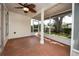 Enclosed screened porch providing an outdoor space for enjoying the fresh air and backyard views at 9130 Dresden Ln, Port Richey, FL 34668