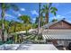 Unique aerial view showcases a multi-level rooftop with trellises and an outdoor kitchen on a sunny day at 921 24Th N Ave, St Petersburg, FL 33704