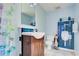 Charming blue bathroom with unique decor, featuring a fun shower curtain and playful accents for a cheerful ambiance at 921 24Th N Ave, St Petersburg, FL 33704
