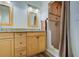 Bathroom with double sink vanity, granite countertop, and standup shower at 921 24Th N Ave, St Petersburg, FL 33704