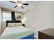 Bright bedroom with ceiling fan, neutral walls, and a pleasant window view at 921 24Th N Ave, St Petersburg, FL 33704