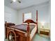 Bedroom features a statement wooden bed frame and nautical themed decor at 921 24Th N Ave, St Petersburg, FL 33704