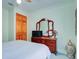Bedroom with wooden dresser and double door closet at 921 24Th N Ave, St Petersburg, FL 33704