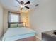 Comfortable bedroom features a ceiling fan, window, and calming decor at 921 24Th N Ave, St Petersburg, FL 33704