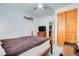 Bedroom featuring dark wooden furnishings and built in cabinets at 921 24Th N Ave, St Petersburg, FL 33704