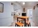 Dining area boasts a view into the kitchen with bar seating and modern design at 921 24Th N Ave, St Petersburg, FL 33704