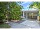 Exterior view of the home featuring a covered carport and well-maintained landscaping at 921 24Th N Ave, St Petersburg, FL 33704