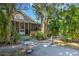 Charming home with lush landscaping, a screened porch, and a inviting entryway at 921 24Th N Ave, St Petersburg, FL 33704