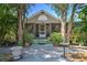 Charming home with lush landscaping, a screened porch, and a inviting entryway at 921 24Th N Ave, St Petersburg, FL 33704