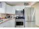 Updated kitchen featuring stainless steel appliances, a gas range, and ample cabinet space at 921 24Th N Ave, St Petersburg, FL 33704