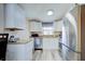 Bright kitchen featuring white cabinetry, stainless steel appliances, and stylish countertops at 921 24Th N Ave, St Petersburg, FL 33704