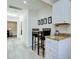 Cozy kitchenette area with granite countertops, modern cabinets, and a breakfast bar at 921 24Th N Ave, St Petersburg, FL 33704