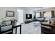 Comfortable living area features modern flooring, a ceiling fan, and a cozy seating arrangement at 921 24Th N Ave, St Petersburg, FL 33704