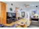 Bright living room with hardwood floors, a brick fireplace, and ample natural light at 921 24Th N Ave, St Petersburg, FL 33704