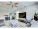 Bright living room offering a ceiling fan, an entertainment center, and comfortable seating at 921 24Th N Ave, St Petersburg, FL 33704