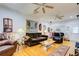 A spacious living room is furnished with hardwood floors, comfortable couches, and unique decor at 921 24Th N Ave, St Petersburg, FL 33704