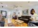 Spacious living room with hardwood floors, a fireplace, and comfortable seating at 921 24Th N Ave, St Petersburg, FL 33704