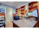 Office space featuring an L-shaped desk and wood built-in shelving at 921 24Th N Ave, St Petersburg, FL 33704