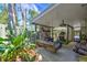 Outdoor patio with lush greenery, comfortable seating, and a serene ambiance at 921 24Th N Ave, St Petersburg, FL 33704