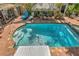 Backyard boasts a refreshing pool with a brick surround, a charming tiki hut, and ample seating at 921 24Th N Ave, St Petersburg, FL 33704