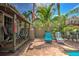 Outdoor entertainment space featuring a tiki hut, seating, and well-maintained brickwork surrounding the pool at 921 24Th N Ave, St Petersburg, FL 33704