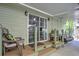 A well-covered porch with seating offers a cozy outdoor retreat at 921 24Th N Ave, St Petersburg, FL 33704