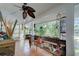 Relaxing porch features tile floors, bright windows, and casual seating at 921 24Th N Ave, St Petersburg, FL 33704