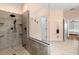 Updated shower with tile surround, rainfall shower head, and glass enclosure at 9322 Wellington Park Cir, Tampa, FL 33647