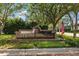 Stonebridge community sign with brick facade and beautiful landscaping at entrance at 9322 Wellington Park Cir, Tampa, FL 33647