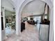Open-concept living area flowing into dining space, showcasing spaciousness and design at 9322 Wellington Park Cir, Tampa, FL 33647