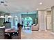 Relaxing living room showcasing tile floors, neutral tones, and seamless flow to the dining area at 9322 Wellington Park Cir, Tampa, FL 33647