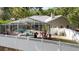 Inviting screened pool with ample deck space surrounded by a well maintained yard and privacy fence at 9322 Wellington Park Cir, Tampa, FL 33647
