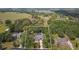 Drone shot showcasing single Gathering home with spacious lot and wooded landscape at 9801 Pine Leaf Ln, Dade City, FL 33525