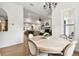 Open-concept dining room with a view of the fireplace and shiplap wall at 9801 Pine Leaf Ln, Dade City, FL 33525