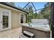 Outdoor hot tub on the patio, enclosed by a screen, providing a private relaxation space with easy access to the house at 9801 Pine Leaf Ln, Dade City, FL 33525