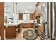 Gourmet kitchen features stainless steel appliances, wood cabinetry and a large kitchen island at 9801 Pine Leaf Ln, Dade City, FL 33525