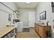 Bright laundry room features wooden countertop, washer and dryer, plus storage at 9801 Pine Leaf Ln, Dade City, FL 33525