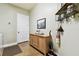 Bright laundry room features decorative touches, wooden countertop, and a closet at 9801 Pine Leaf Ln, Dade City, FL 33525