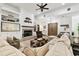 Bright living room with shiplap walls, fireplace, and comfortable sectional sofa at 9801 Pine Leaf Ln, Dade City, FL 33525