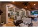 Comfortable outdoor living on this covered patio, with views into the home and backyard screened-in pool at 9801 Pine Leaf Ln, Dade City, FL 33525