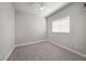 This bedroom is painted in neutral tones and features carpet, baseboard, and a ceiling fan at 1018 Tracey Ann Loop, Seffner, FL 33584