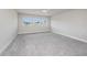 Bedroom featuring neutral walls and carpet with large windows that let in an abundance of light at 1018 Tracey Ann Loop, Seffner, FL 33584