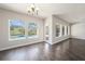 Bright dining room featuring a pool view through the oversized glass windows at 1018 Tracey Ann Loop, Seffner, FL 33584