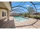 Inviting screened-in pool with paver deck, perfect for relaxation and outdoor entertaining at 1018 Tracey Ann Loop, Seffner, FL 33584