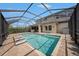 This screened-in pool features a large pool deck and easy access to the home at 1018 Tracey Ann Loop, Seffner, FL 33584
