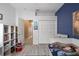 Charming bedroom boasts a playful decor and ample storage space for all your needs at 10602 Rochester Way, Tampa, FL 33626