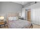 Comfortable bedroom featuring neutral tones, plush bedding, and a vanity area at 10602 Rochester Way, Tampa, FL 33626